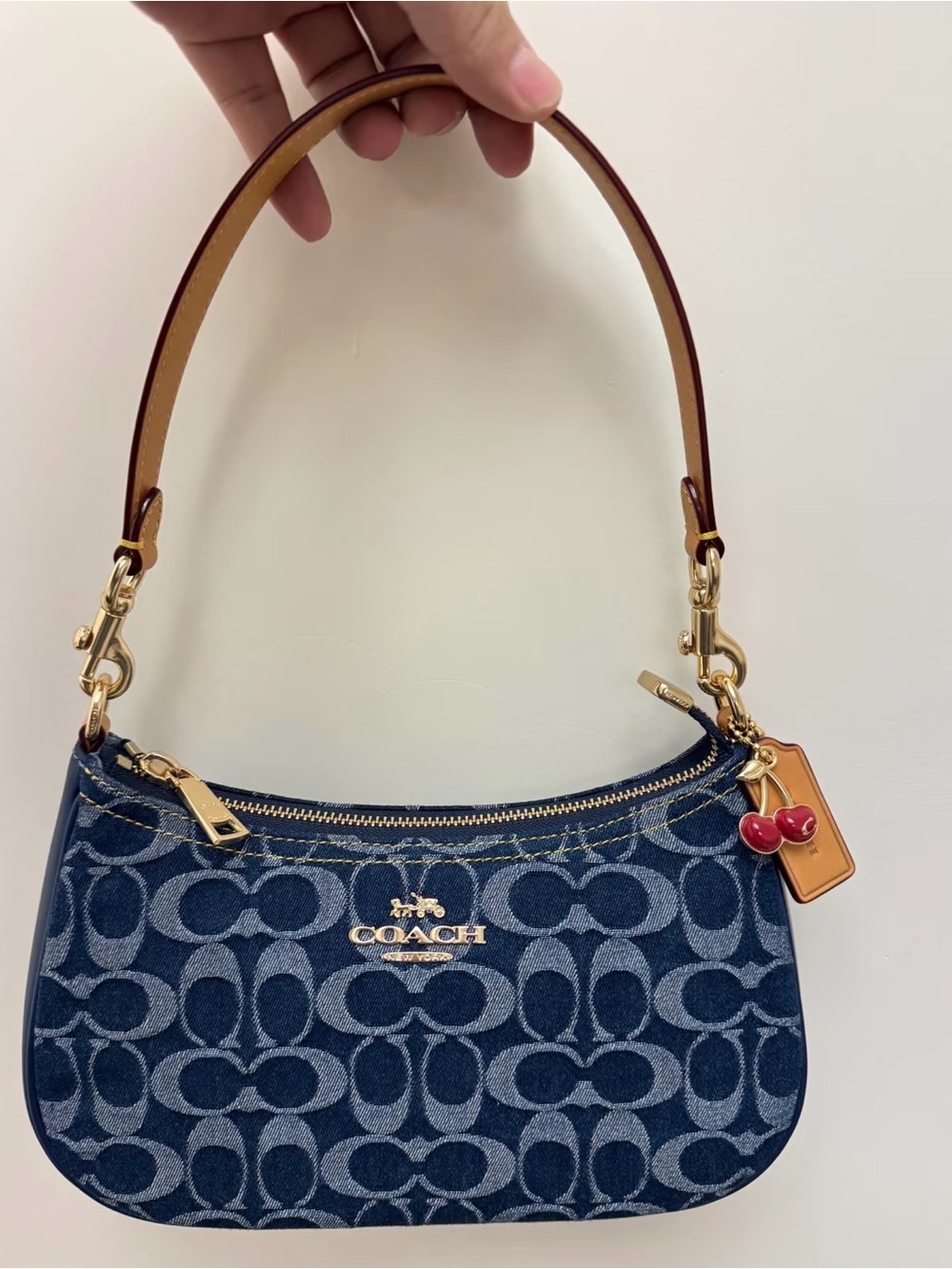 Coach Navy Signature Mini Shoulder Bag with Tan Strap and Red Charm